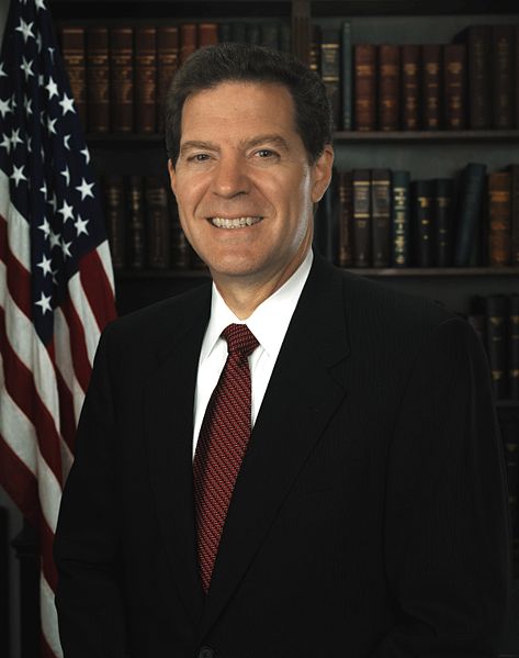 Sam Brownback, United States Senator photo portrait.  This United States Congress image is in the public domain. This may be because it is an official Congressional portrait, because it was taken by an official employee of the Congress, or because it has been released into the public domain and posted on the official websites of a member of Congress. As a work of the U.S. federal government, the image is in the public domain.